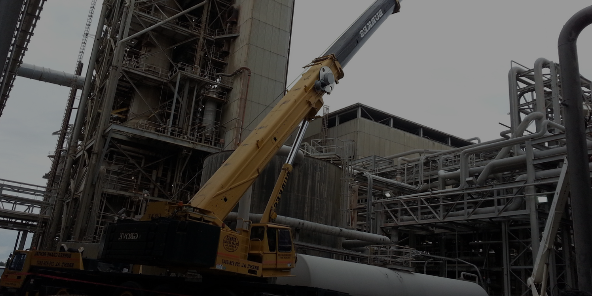 Burkes crane performing an outage lift inside an industrial plant, handling complex equipment removal and installation.