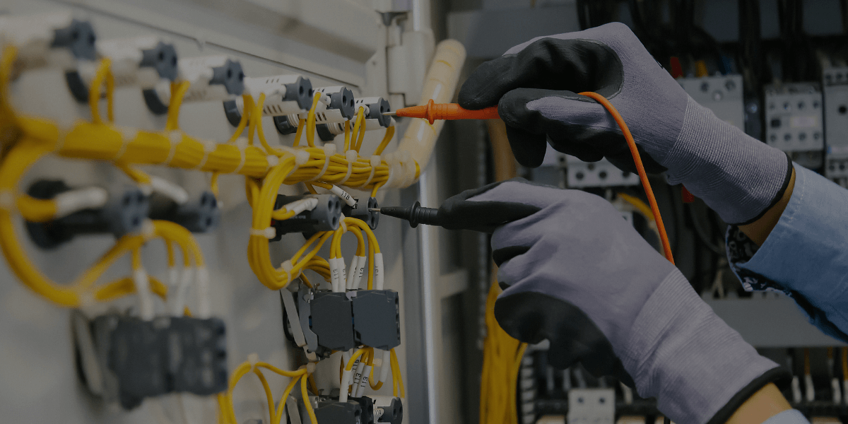 a worker verifying control systems representing Burkes' Start-Up and commissioning services