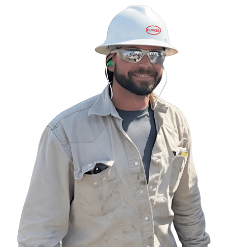 Burkes Electrical Department employee in safety glasses, ear plugs, safety glasses, tan shirt, and white hard hat.