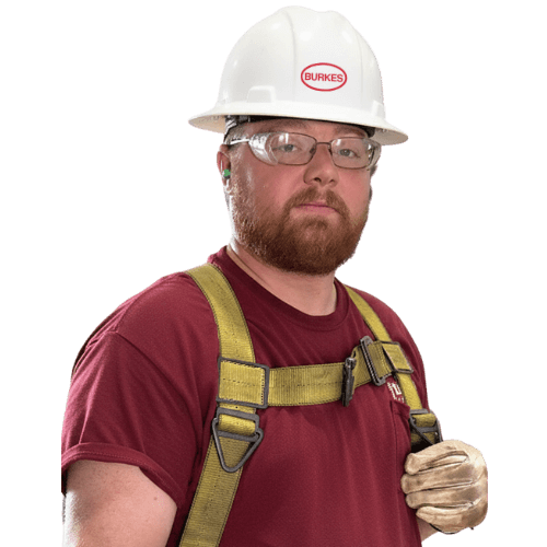 Burkes Mechanical department employee in red shirt, safety glasses, harness, and hard hat