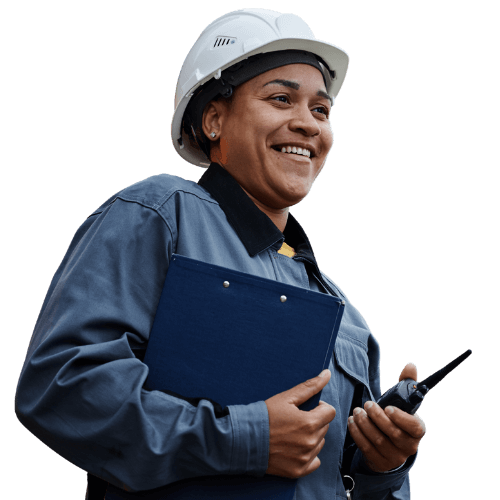 Smiling female industrial safety officer wearing a hard hat and holding a clipboard and two-way radio, representing certified crane operations and OSHA-compliant safety protocols.