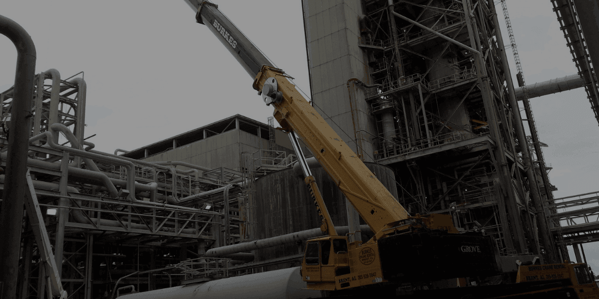 Burkes Mechanical industrial crane performing heavy equipment installation inside processing facility, supporting shutdowns, outages, and capital project execution