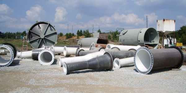 Burkes Mechanical fabricated industrial pipe spools, flanged fittings, and large diameter vessels staged at a job site in the Southeast US, showcasing certified pipe fabrication services for industrial contractors