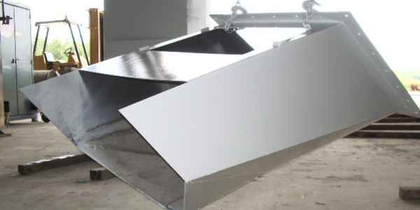 Burkes Mechanical fabricated structural steel chute exterior panels and assembly staged in the fabrication shop in Alabama, showcasing custom structural steel fabrication and precision sheet metal work for industrial material handling systems in the Southeast US