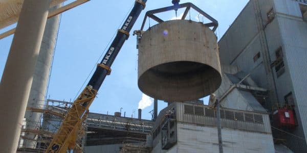 Crane lifting and setting large industrial vessel at manufacturing facility, supporting equipment installation, plant upgrades, and outage projects across the Southeast